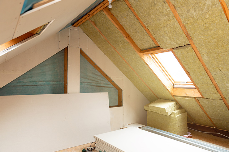 Picture of a loft with window and loft insulation being installed