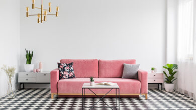 Picture of a living room with chequered floor and pink sofa