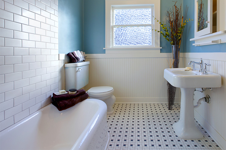 Picture of a bathroom with geometric patterned floor tiles