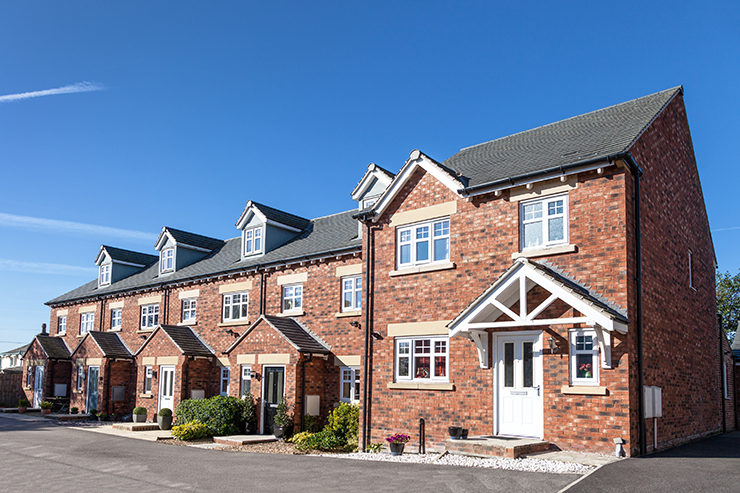 Picture of the exterior of a row of new terraced homes 