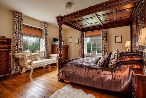 Picture of a period property with wooden bed frame 