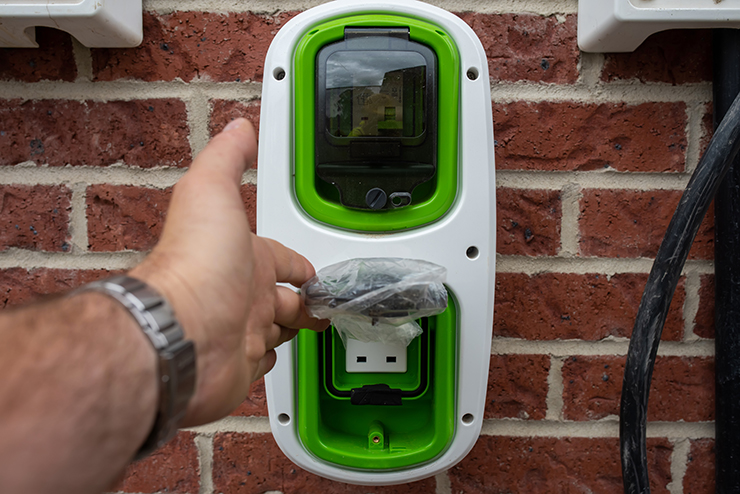 Picture of a green and white electric car home charging point