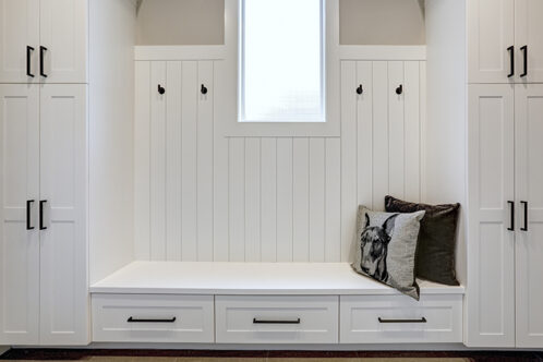 Picture of a hallway with a nook with pillows to sit on