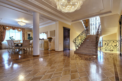 Picture of a large hallway with staircase