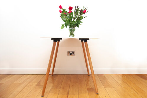 Picture of a table with flowers and plug socket