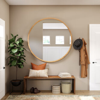 Picture of a round mirror on a wall