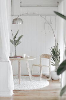 Picture of a living room with minimalistic cream and white colours and plants