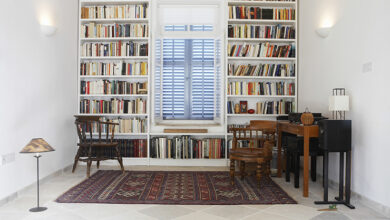 Picture of a small room with two floor to ceiling bookshelves