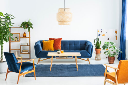 Picture of a living room with orange and blue colour scheme 