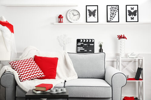 Picture of a living room with a black and red colour scheme