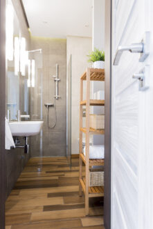 Picture of a narrow bathroom with tiles 