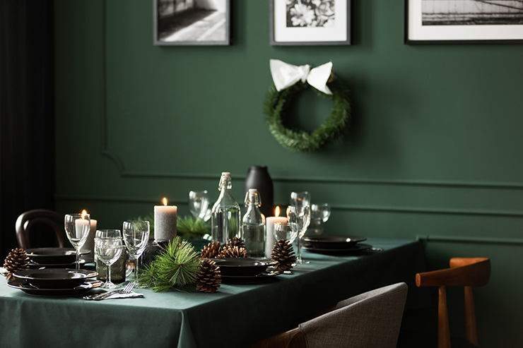 Picture of a table with festive Christmas decor and green walls