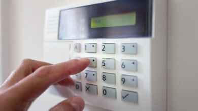 Picture of a finger on an alarm system