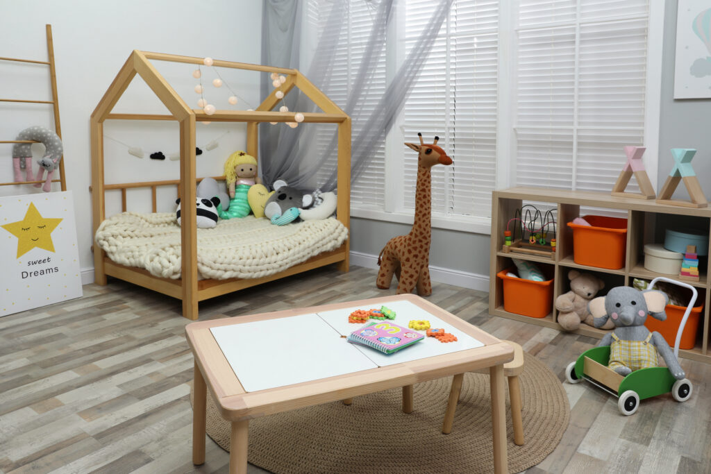 Picture of a playroom with toys and low bed