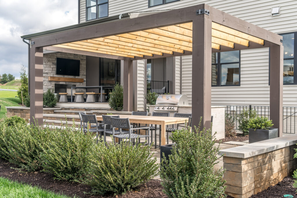 Picture of a outdoor space with a pergola and plants 