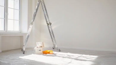 Picture of a room being painted with ladder and bucket