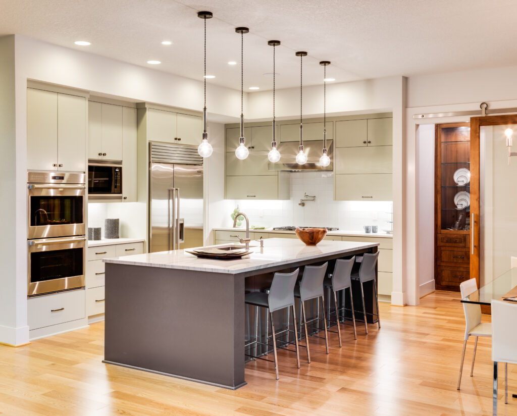 Picture of a modern kitchen with wooden floors and light fixtures