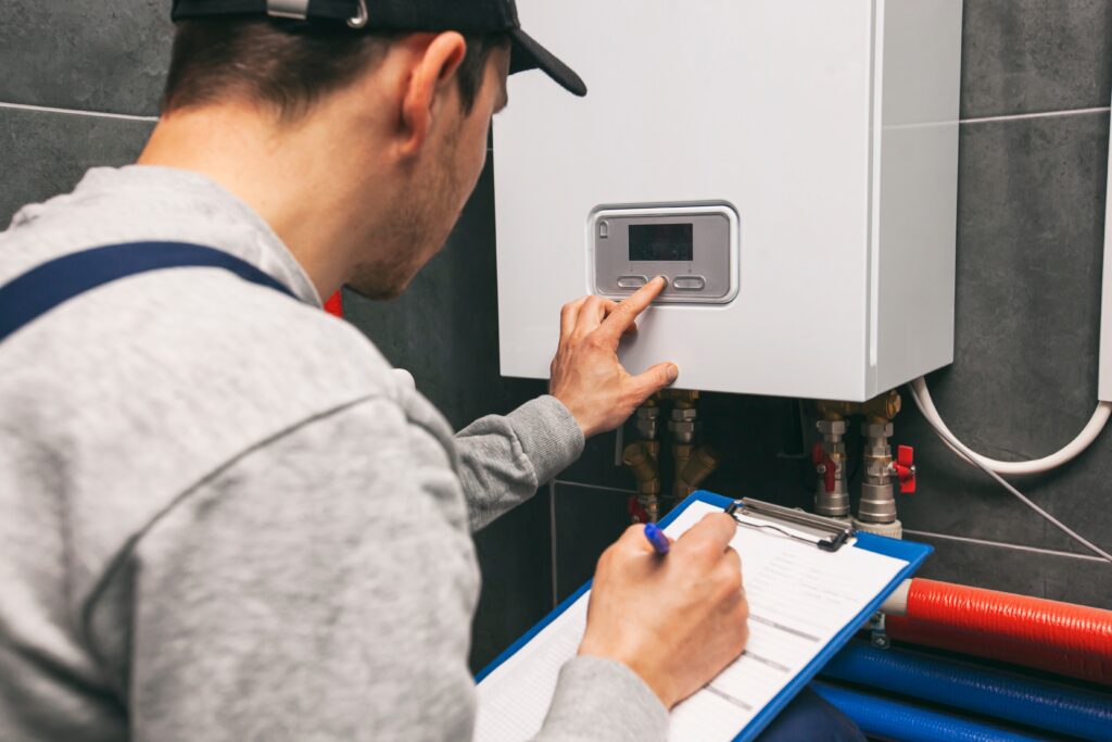 Picture of a heating engineer servicing a boiler