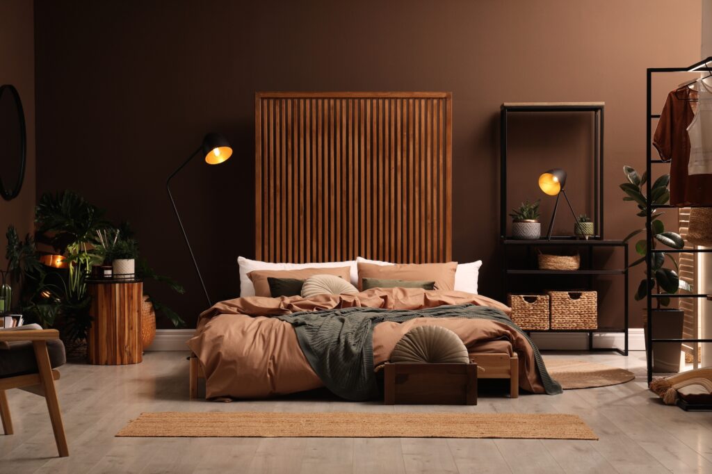 Picture of a bedroom with large king size bed and brown walls