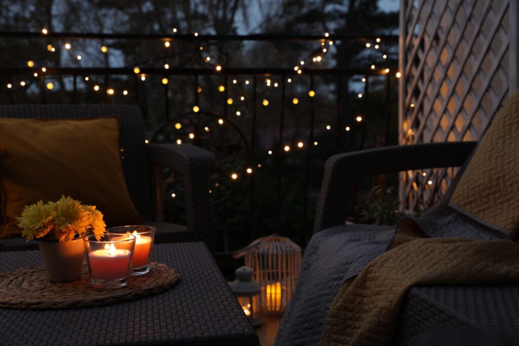 Picture of a garden with cosy furniture and candles and fairylights