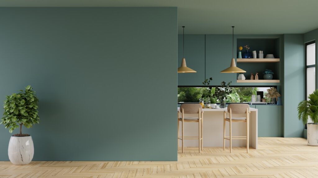 Picture of a kitchen in a broken plan home with partial green walls