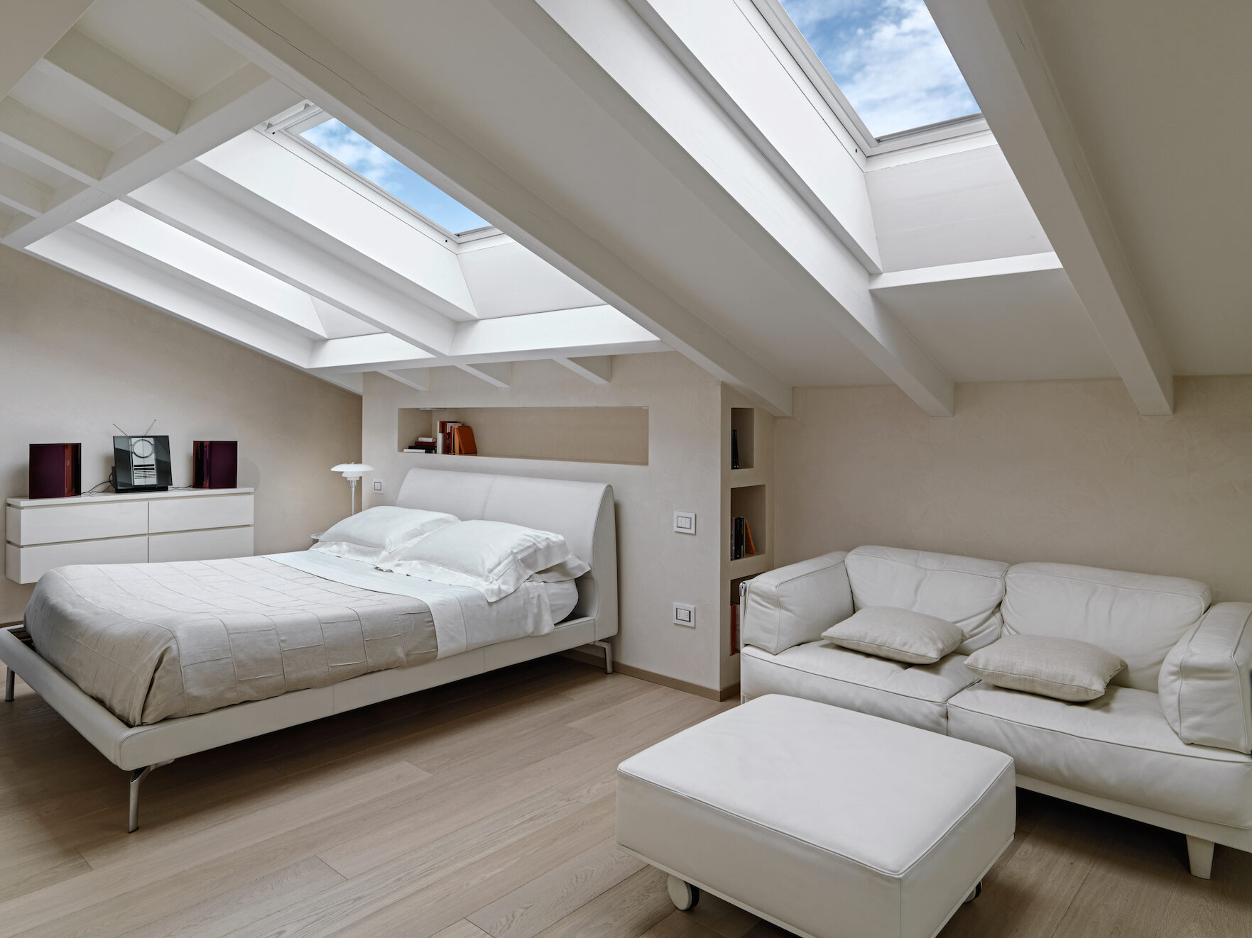 Picture of a loft bedroom with large skylights
