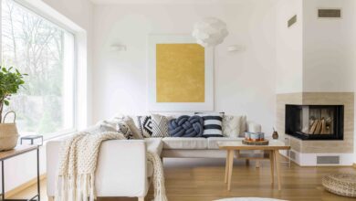Picture of a hygge interior design living room with a sofa and a large yellow painting