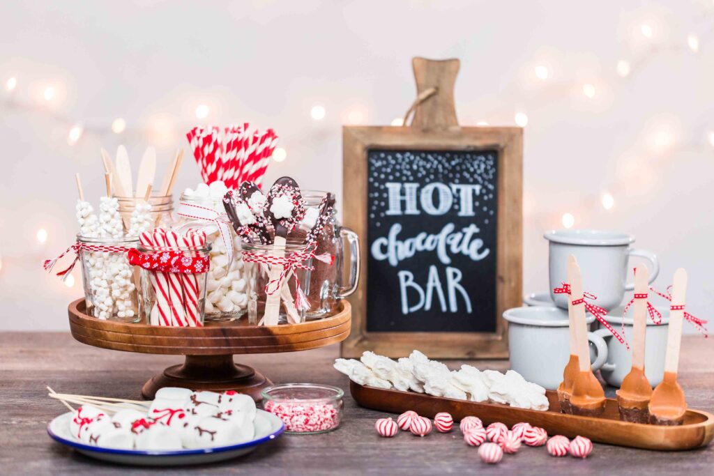 Picture of a hot chocolate station with candy canes and white mugs 